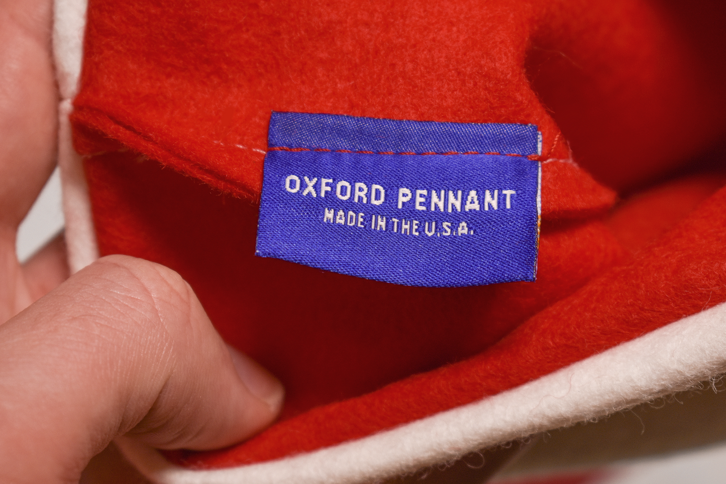 Custom felt stocking handmade in Buffalo by Oxford Pennant! Measures 14" x 19". Names are cut and hand-sewn using traditional wool felt. Stockings are produced and shipped weekly. Further customizations (i.e. font, color) are not available. 10 character limit.