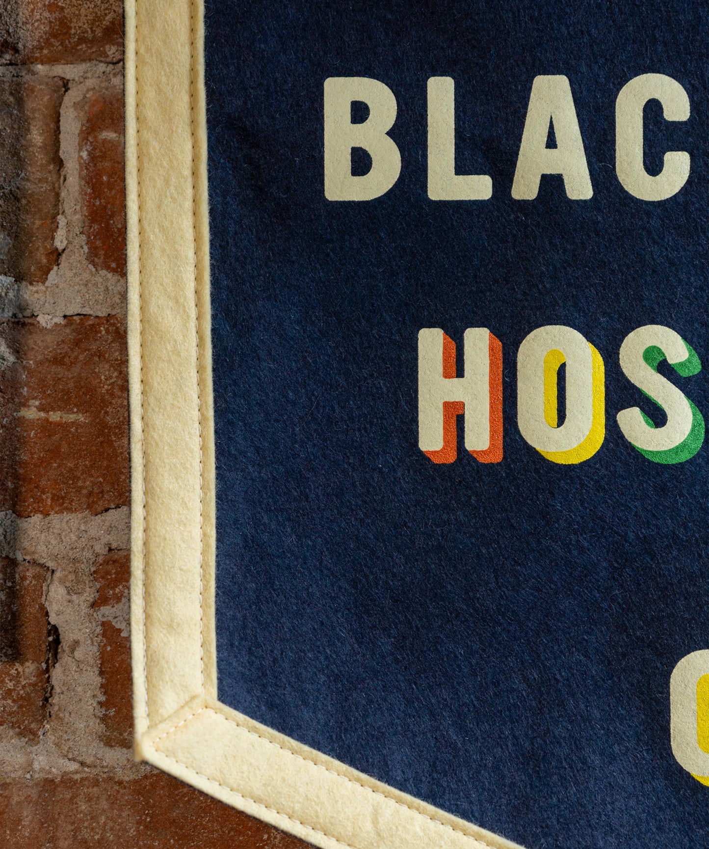 Service Is Black & White Hospitality Is Color Camp Flag • Unreasonable Hospitality x Oxford Pennant