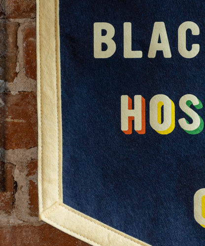 Service Is Black & White Hospitality Is Color Camp Flag • Unreasonable Hospitality x Oxford Pennant