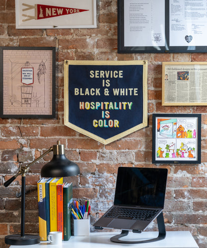 Service Is Black & White Hospitality Is Color Camp Flag • Unreasonable Hospitality x Oxford Pennant