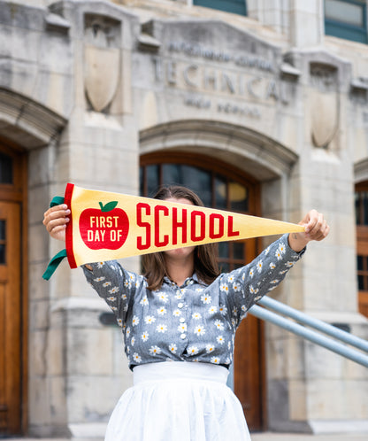 Woman holding First Day of School Pennant